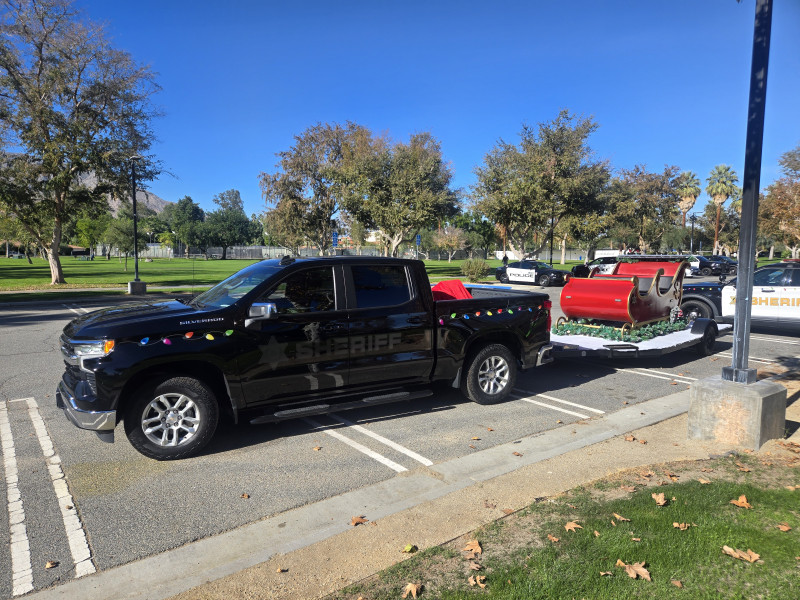 Santa's sleigh on a trailer behind a pickup truck